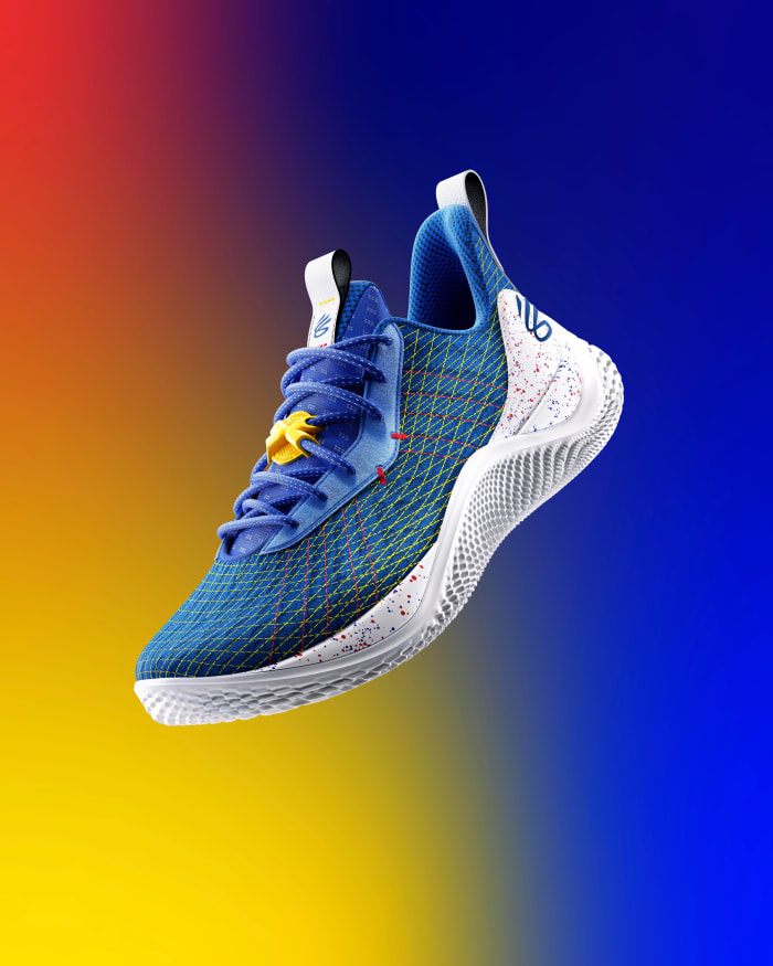 View of blue and white Curry shoe.